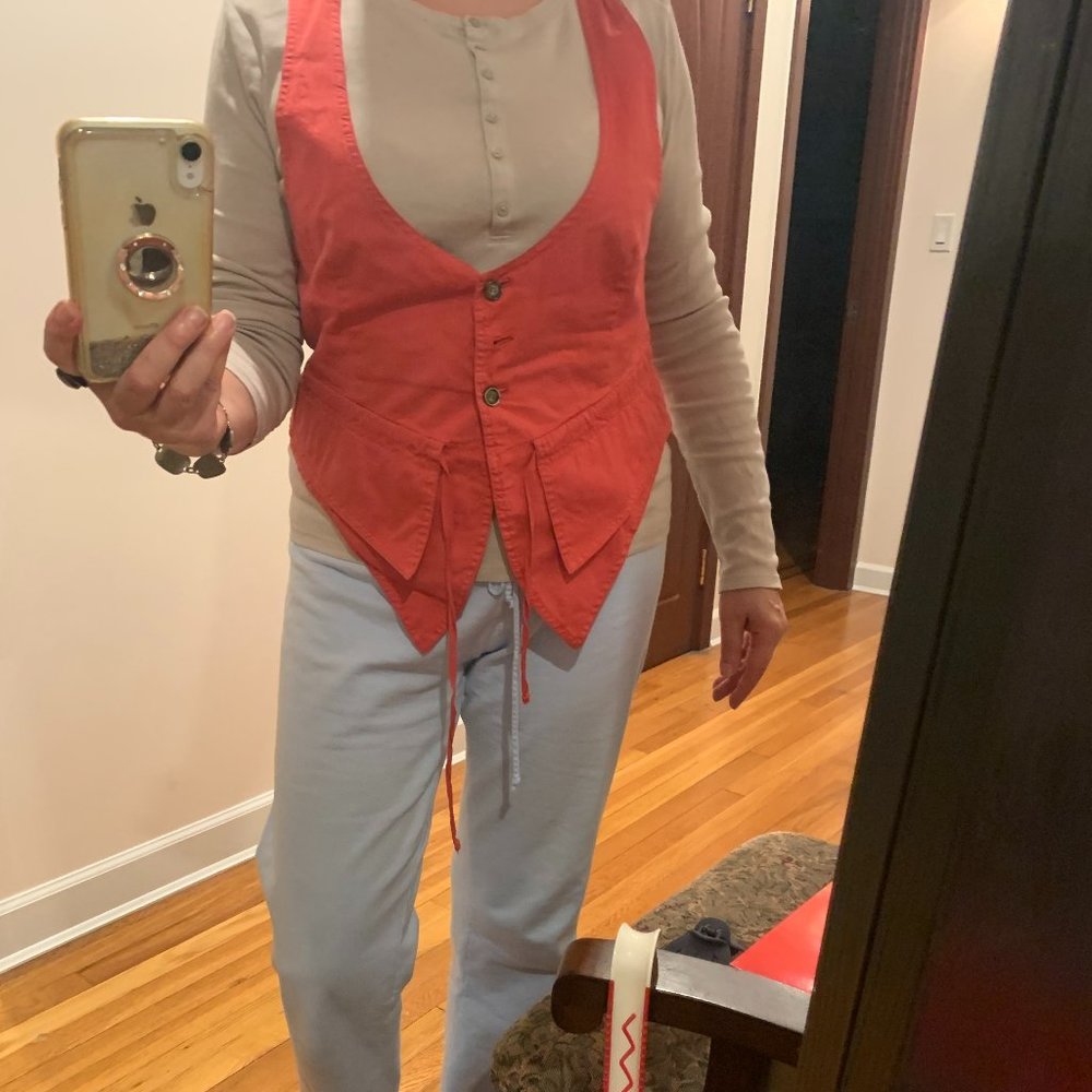 Contemporary vest, red with stripes, cotton. Deeply open on the front.